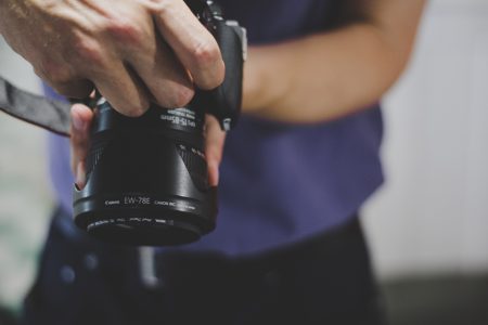 Photographer Holding Camera